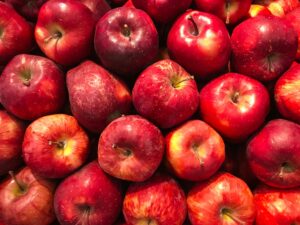 A vibrant collection of fresh red apples showcasing healthy abundance.