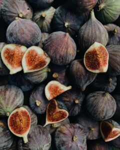 Enjoy a close-up view of fresh, organic figs, highlighting their nutritious, delicious appeal.